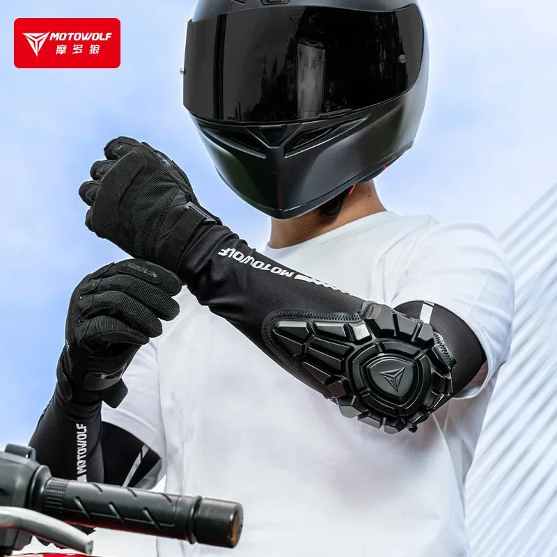 Person wearing a black motorcycle helmet and gloves with Motowolf branding on a light blue background.