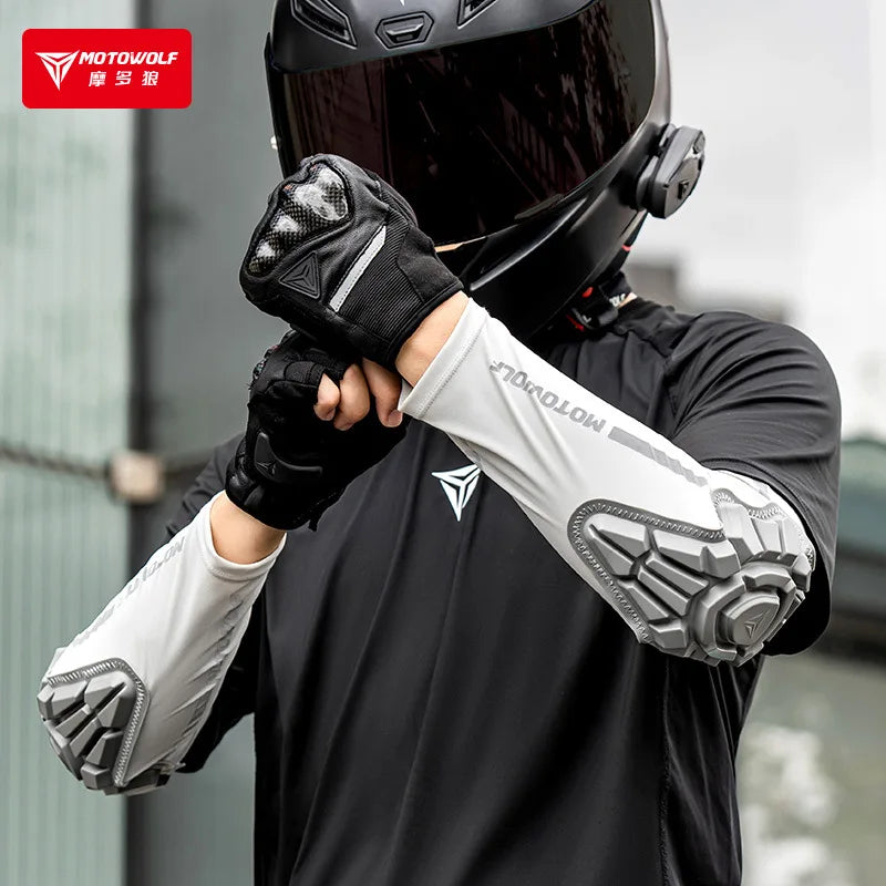Person wearing a black helmet and Motowolf-branded gloves and jacket outdoors.